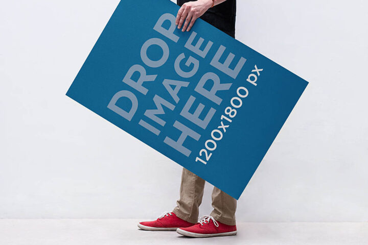 Man Holding Poster – Free Mockup